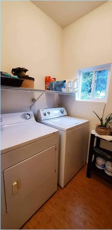 The same laundry room after a CCR clean, surfaces cleared and wiped