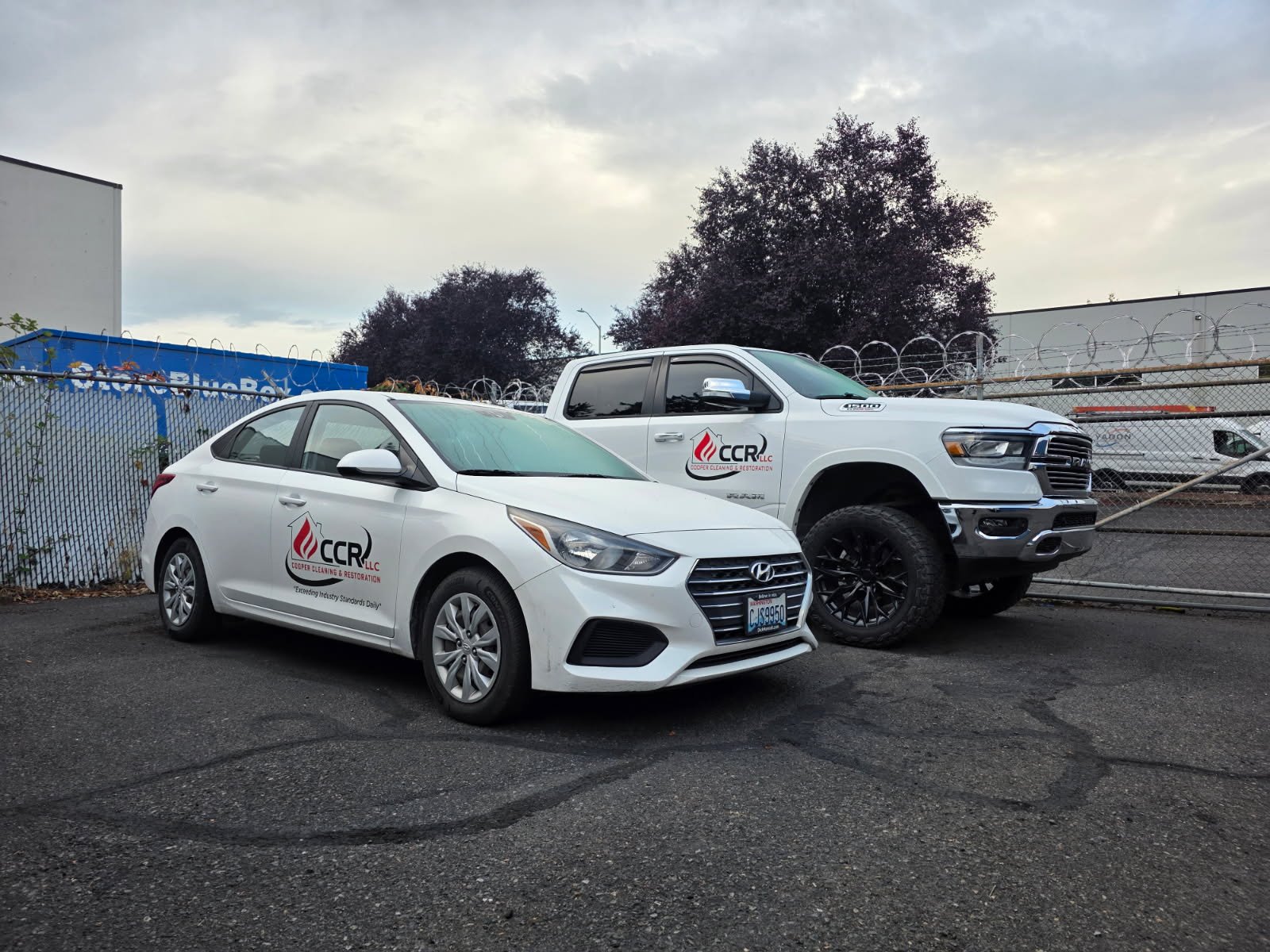 A CCR car and pickup truck, both carrying the company logo