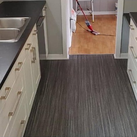 A kitchen and hallway floor after a CCR clean